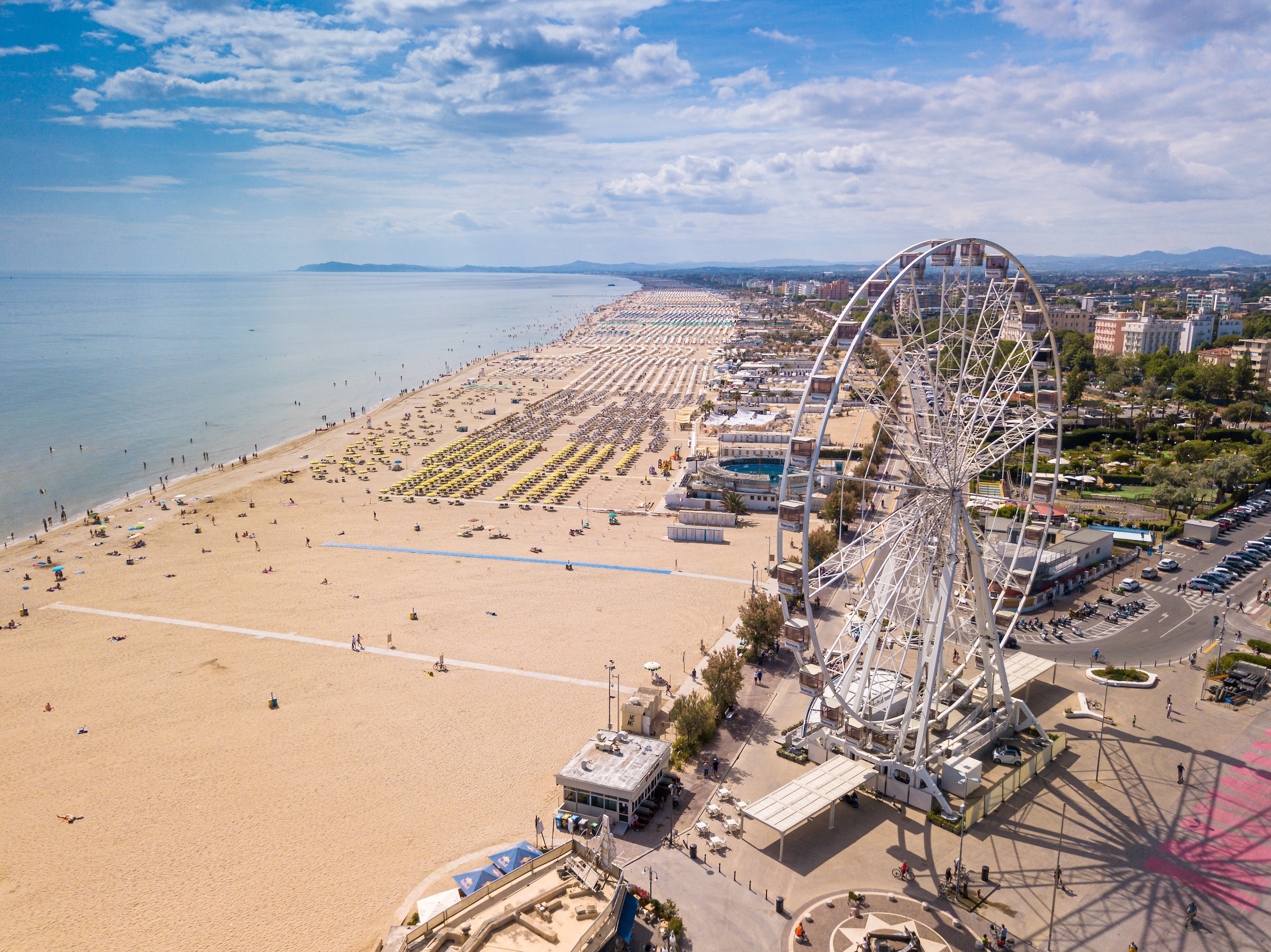 RIMINI, IT - Jun 09, 2021: A bird's eye view of a Ferris wheel of Rimini and the whole Romagna coast, Italy